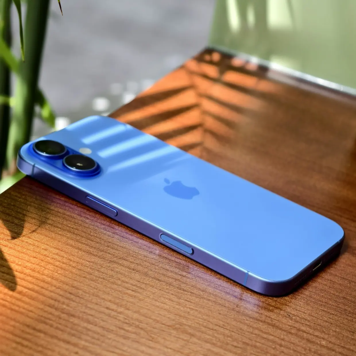 Blue Apple iPhone on a table