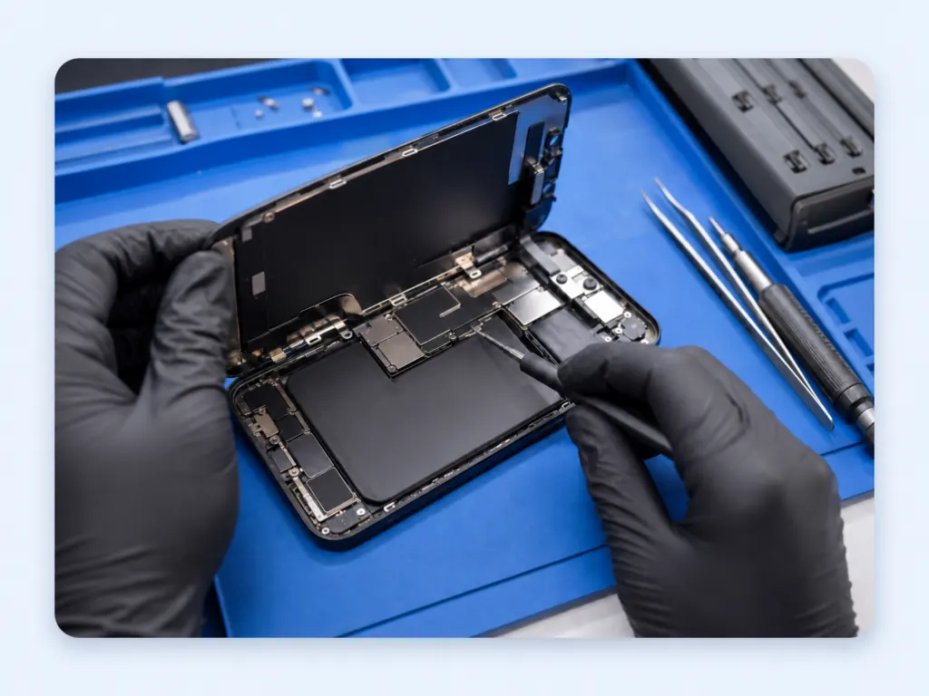 Technician opening an iPhone for screen repair in Dothan AL
