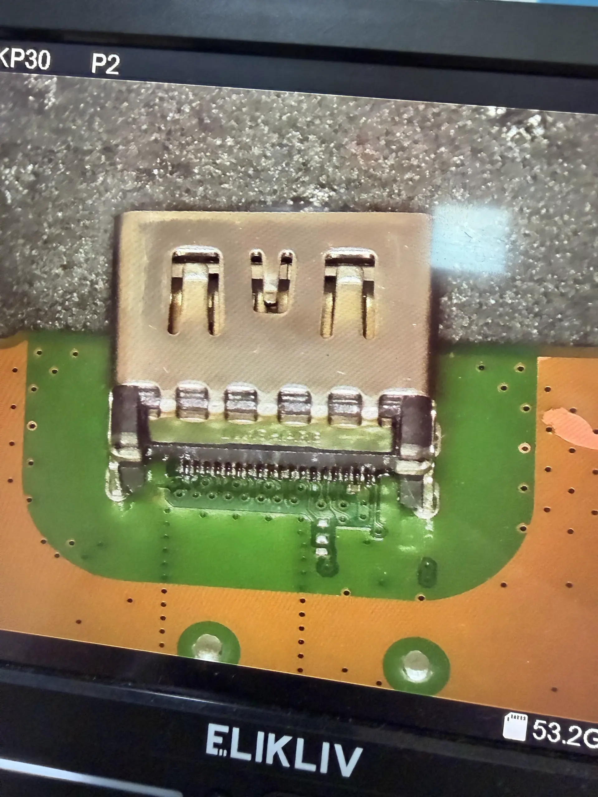 Installed console HDMI port and solder connections photographed by our Chattanooga, Tennessee team